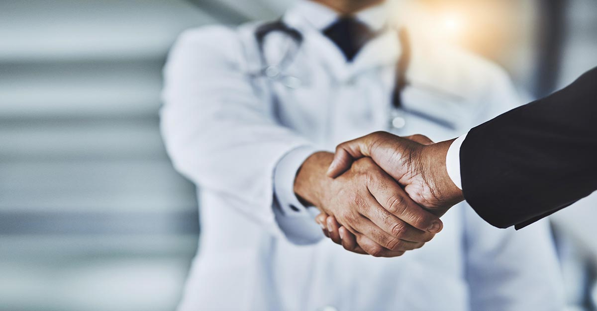 Medical professionals shaking hands